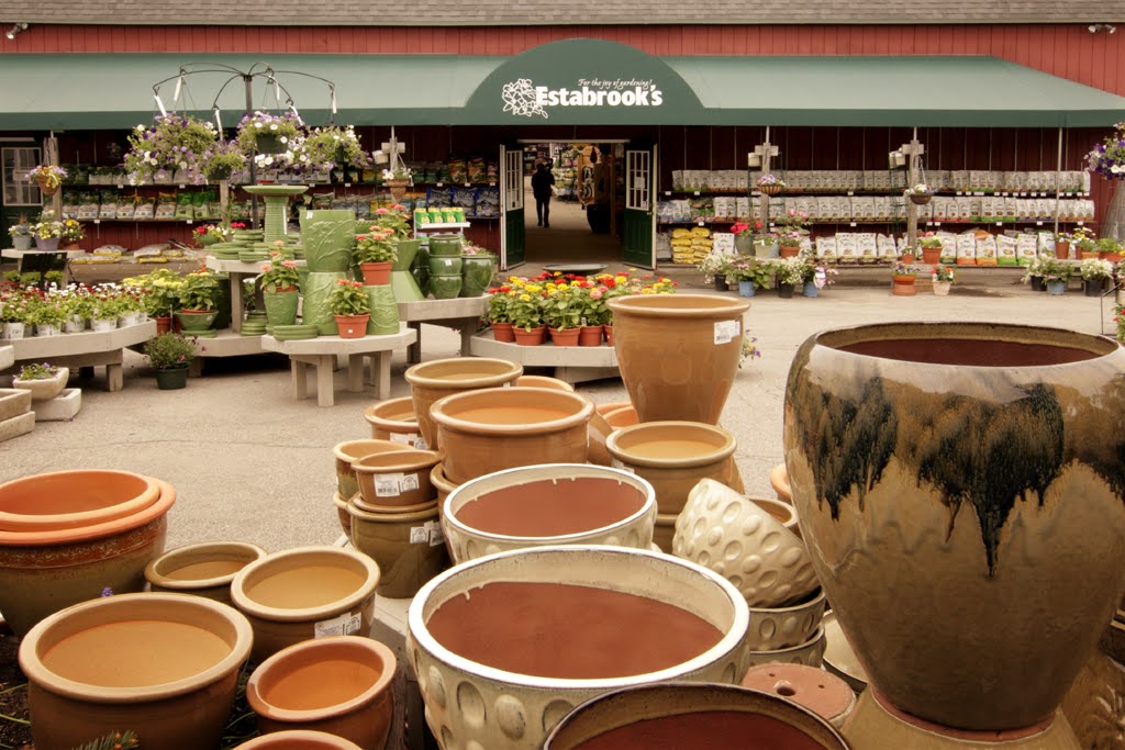 Estabrook's garden emporium entrance with pottery and flowers