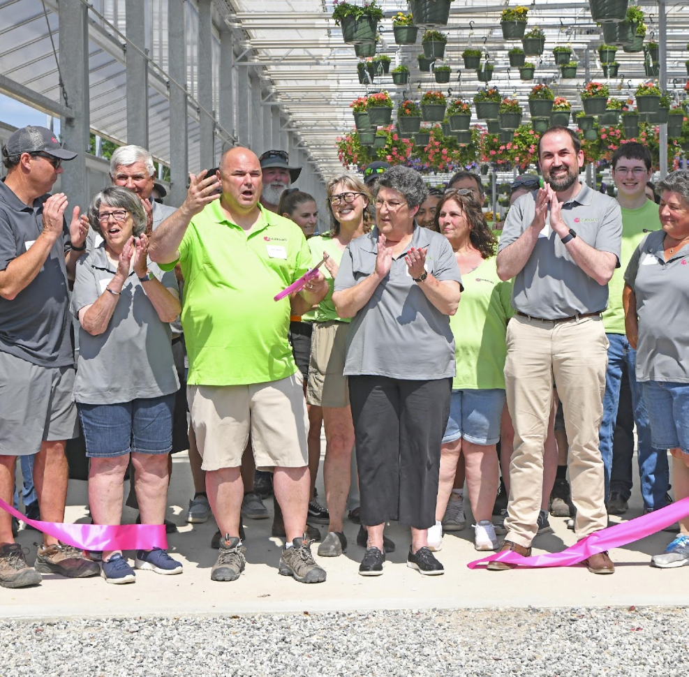 Estabrook's team members celebrating at the Pownal greenhouse ribbon cutting
