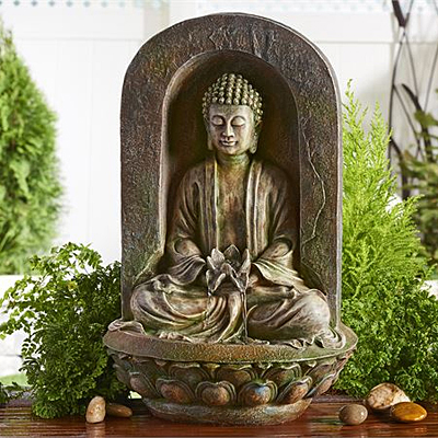 Decorative garden fountain surrounded by greenery