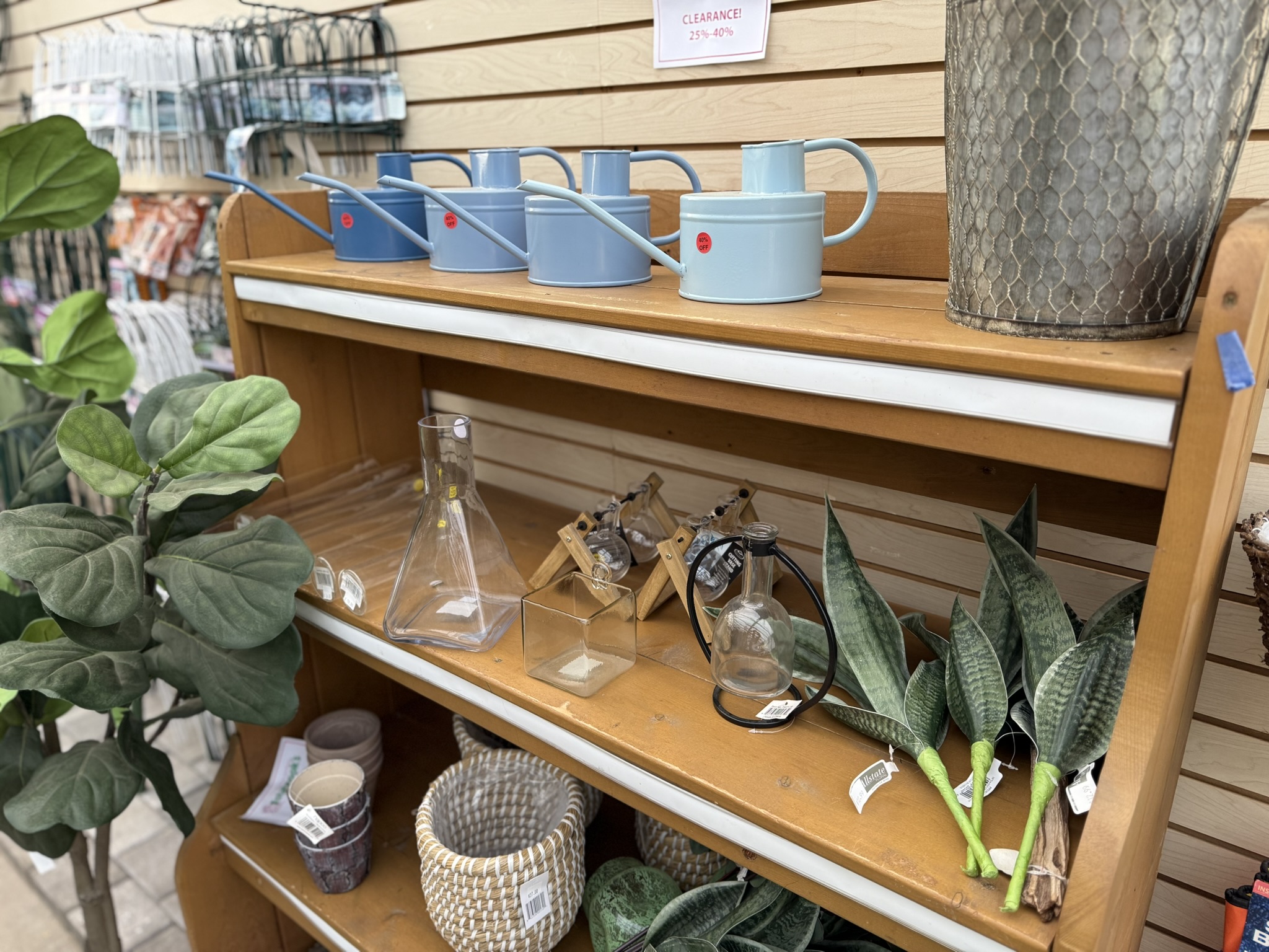Clearance watering cans, plants and garden decor at Estabrook's Yarmouth garden center